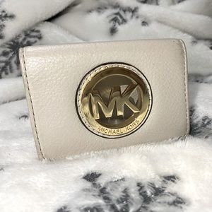 Cream coloured coin purse from Micheal Kors